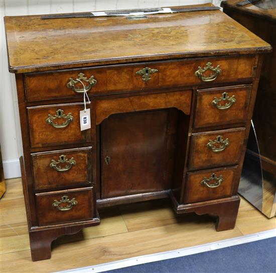 A mid 18th century walnut kneehole desk W.82cm